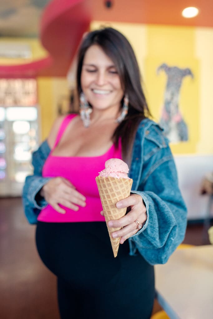 photography session of pregnant woman with ice cream cone